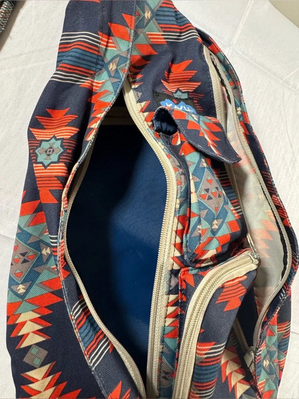 Kavu Rope Sling Bag in Navy with Red & Teal Pattern